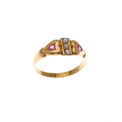 A Victorian seed pearl and ruby ring, three bead set seed pearls, two bead set rubies in heart motif. Yellow gold. Weight 2.3 grams. Size N.