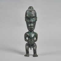 A Cast Bronze Tekoteko