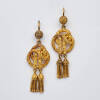 A pair of gold knot and tassel drop earrings, twisted rope motif with two tassels. Gold. Weight 6.7 grams. Length 45mm.