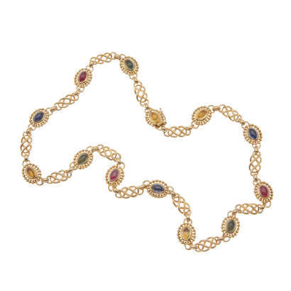 A multi-coloured sapphire and ruby necklace, Georg Jensen. Fourteen bezel set cabochon cut multi-coloured sapphires and rubies of estimated total weight 7.0 carats, accented with gold twisted knot links. 18ct yellow gold. Weight 35.2. Length 38.5cm. Four 