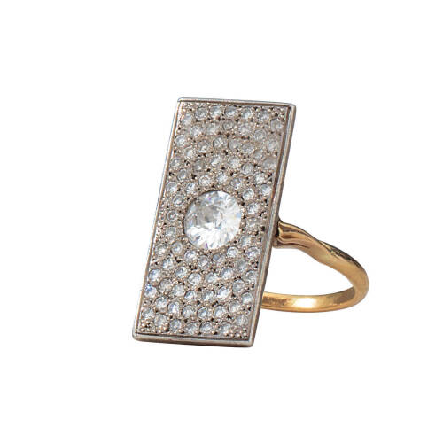 A rectangular diamond cluster ring, bead set early round brilliant cut centre diamond of estimated weight 0.48 carat, surrounded by seventy-seven pave set single cut diamonds of estimated total weight 0.60 carats. Silver and 18ct yellow gold. Weight 4.7 g