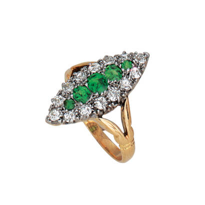 A demantoid garnet and diamond navette-shaped cluster ring, graduated oval and round cut demantoid garnets of estimated total weight 0.57 carats, surrounded by old European and Swiss cut diamonds of estimated total weight 0.60 carats. 18ct yellow gold. We