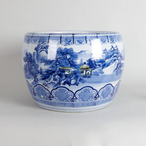 A Japanese Blue and White 'Landscape' Heater