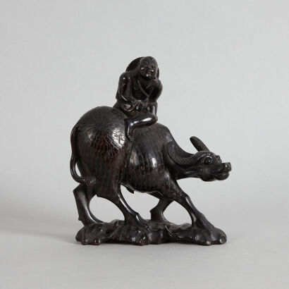 A Chinese Late Qing Dynasty Wood Carved Silver Inlaid 'Kid and Buffalo' Ornament