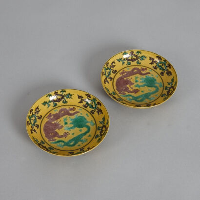 A Pair of Chinese Yellow Ground Green and Aubergine 'Twin-dragon' Saucers (Da Qing Guangxu Nian Zhi Mark)