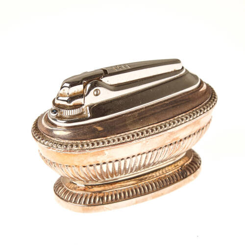 A Ronson Queen Ann Varaflame, lint & gas table lighter finished in silver plate