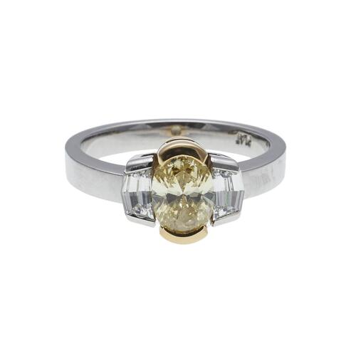 Platinum and 18ct Fancy Intense Yellow and White Diamond Three Stone Ring