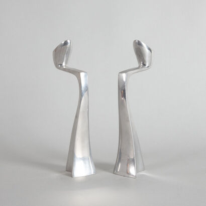 A Pair of Matthew Hilton Swan Alloy Candlestick Holders