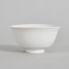A Chinese White-Glazed Engraved Bowl (Qianglong Nian Zhi Mark)
