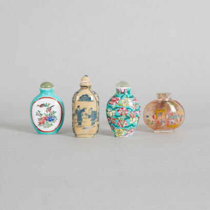 A Chinese Glass Snuff Bottle, A Chinese Blue and White Snuff Bottle & Two Famille Rose Snuff Bottles