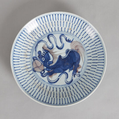 A Chinese Mid Qing Dynasty Underglaze-red and Blue 'Lion' Saucer