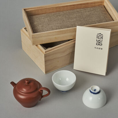 A Chinese Red Clay Teapot (Zhao Fei Zhi Mark) and Two White Glazed Tea Cups