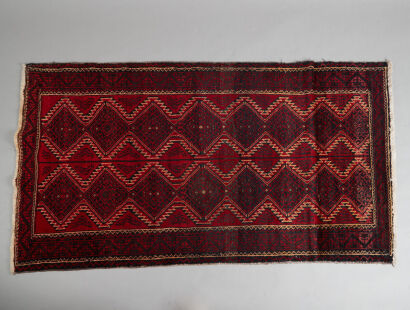 A Hand-Knotted Persian Baluchi Rug