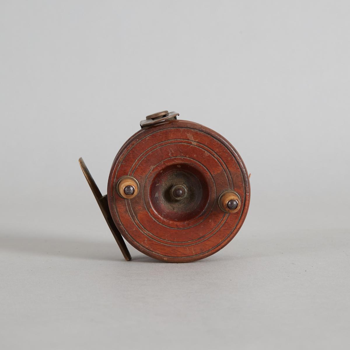A Vintage Wood and Brass Fly Reel