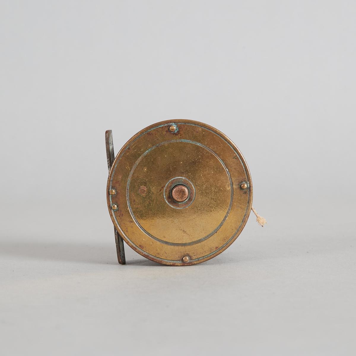A Vintage Brass and Steel Fly Reel