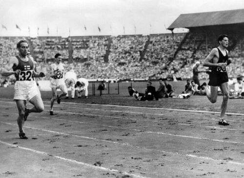 J.M. Holland, right, winning heat three of the 400 Meter Hurdles event at Wembley Stadium, 1948