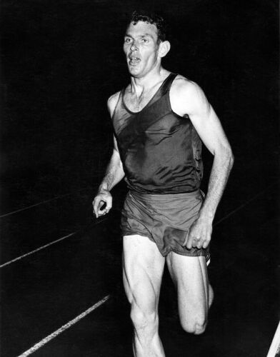 MICHAEL P. CONWAY Peter Snell heads into the last lap of his world record run in the Rothmans International mile at Western Springs, Auckland, c1962