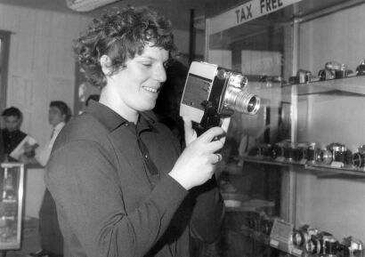 New Zealand swimmer Vivian Hadden visits the Olympic Village camera shop in Tokyo, 1964