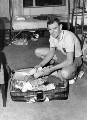 Olympian Scott Davie unpacks his suitcase in Olympic Village, Tokyo, 1964