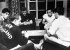 New Zealand athletes W. Schaefer, J. Anslow, P. Bygrave, and A. Patterson playing cards in Olympic Village, Tokyo, 1964