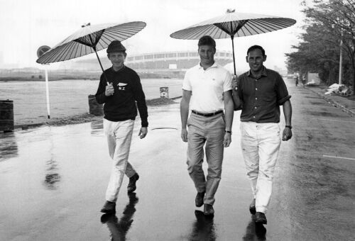 Members of the New Zealand Equestrian team, Charlie Mathews, Graeme Hansen, and Adrian White, walking around the Yoyogi Olympic Village in Tokyo, 1964