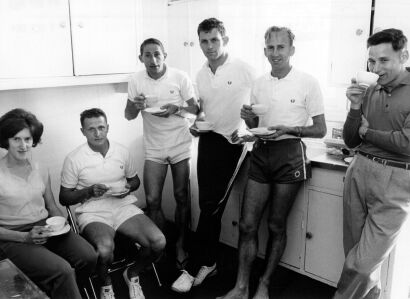 Avis McIntosh, Arthur Lydiard, Bill Baillie, Peter Snell, Barry Magee, and Ivan Keats have a cup of tea after a training session in Tokyo, 1964