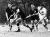 New Zealand Olympic hockey players Peter Byers and Brian Maunsell race after the ball during a practice game with Australia at the Komazawa Hockey field in Tokyo, 1964