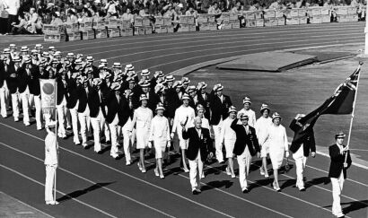 Olympian Peter Snell carrying the New Zealand flag during the opening ceremonies in Tokyo, 1964