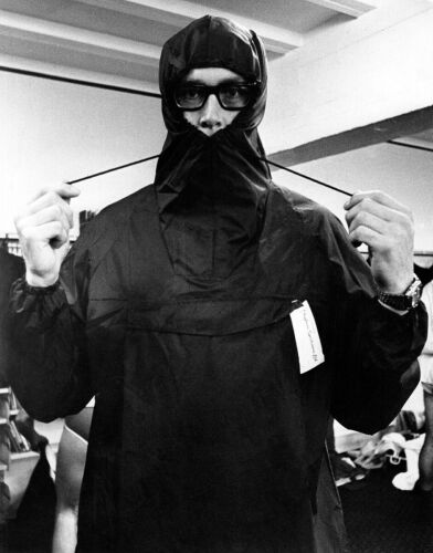 New Zealand rower John Hunter clowns around while trying on his Olympic uniform, 1972