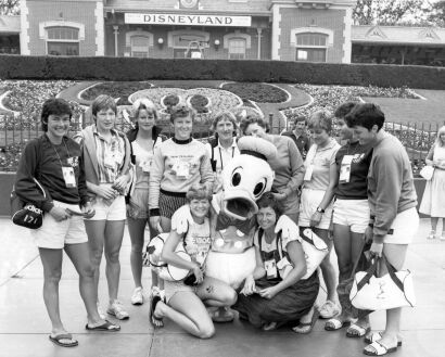 New Zealand women's field hockey team with Donald Duck during a visit to Disneyland, 1984