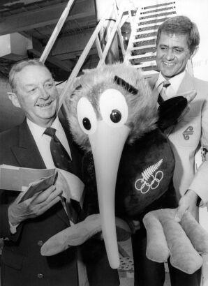 Goldie, the Olympic Games mascot, and Mr. Lance Cross, president of the Olympic Games Association, prepare to board an Air New Zealand flight bound for Los Angeles, 1984