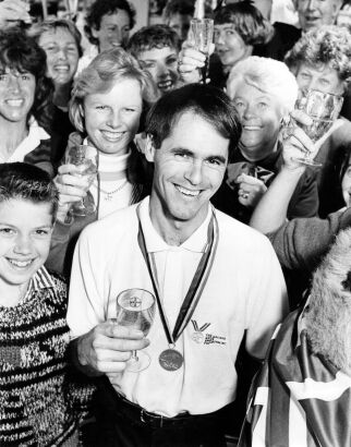 PHIL CRAWFORD New Zealand's Blyth Tait celebrates his win at the World Equestrian Games with a toast, 1990