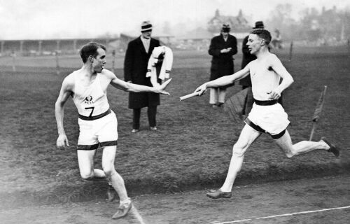 Jack Lovelock handing the baton to Hal Lowell during the Inter-Varsity Relays at Oxford University, 1934