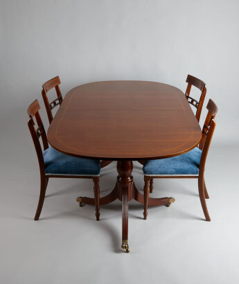 An Antique Extension Dining Table with Chairs