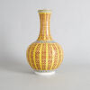 A Chinese Yellow-ground Famille Rose 'Shuangxi' and 'Longevity' Bottle Vase (Da Qing Guangxu Nian Zhi Mark)