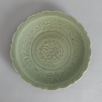 A Chinese Early Ming Dynasty Incised Longquan Barbed-rim Dish