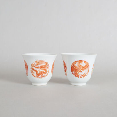 A Chinese Qing Dynasty Guangxu Period Iron-red 'Dragon and Phoenix' Medallion Cups (Da Qing Guangxu Nian Zhi Mark)