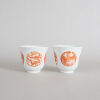 A Chinese Qing Dynasty Guangxu Period Iron-red 'Dragon and Phoenix' Medallion Cups (Da Qing Guangxu Nian Zhi Mark)