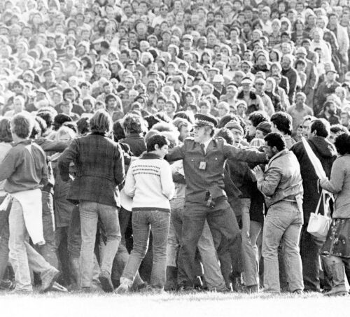 Spectators held inside Lancaster Park by police officers until protesters dispersed