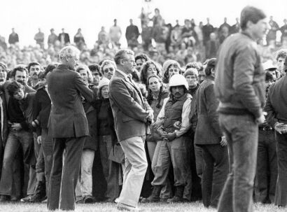 Inspector Brian Davies, head of Operation Rugby, with protesters on the field during a match