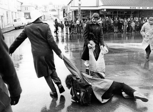 Demonstrators dragged away from Rintoul Street during a protest near Athletic Park