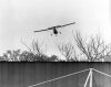 The low-flying Cessna plane makes a pass over Eden Park