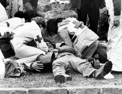 An injured protestor gets treated by the first aid team after a confrontation near Eden Park