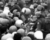 Protesters and police officers dressed in riot gear during a demonstration outside Eden Park