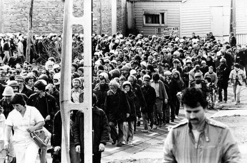 Anti-tour protesters march through the streets during a public demonstration