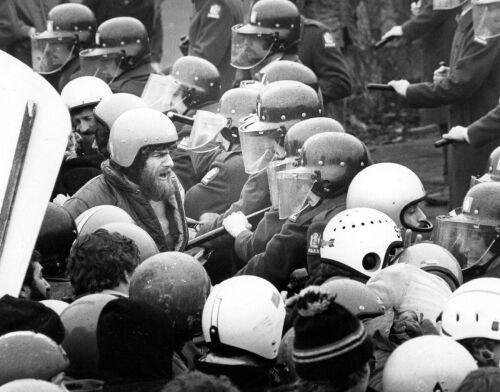 Riot squad unit moves in front of a 5,000-strong march, using batons to turn protesters away from Lancaster Park