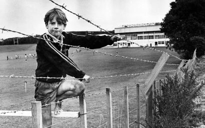 Michael Evans (9) of New Plymouth inspects the new security fence that has been built around Rugby Park, New Plymouth