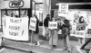 Members of the Taranaki Anti-Apartheid Movement maintain a silent vigil across the street from the Springboks' hotel