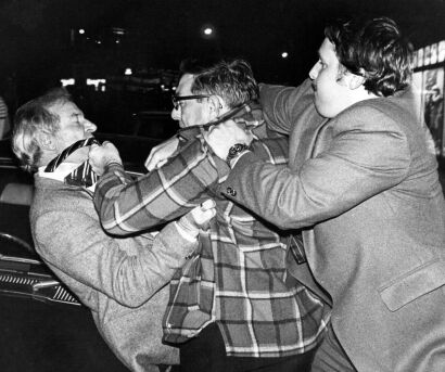 An anti-tour protester gets involved in a scuffle with pro-tour supporters during a march in Wellington