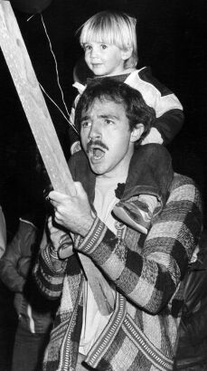 A father and son march in an anti-tour demonstration in New Plymouth